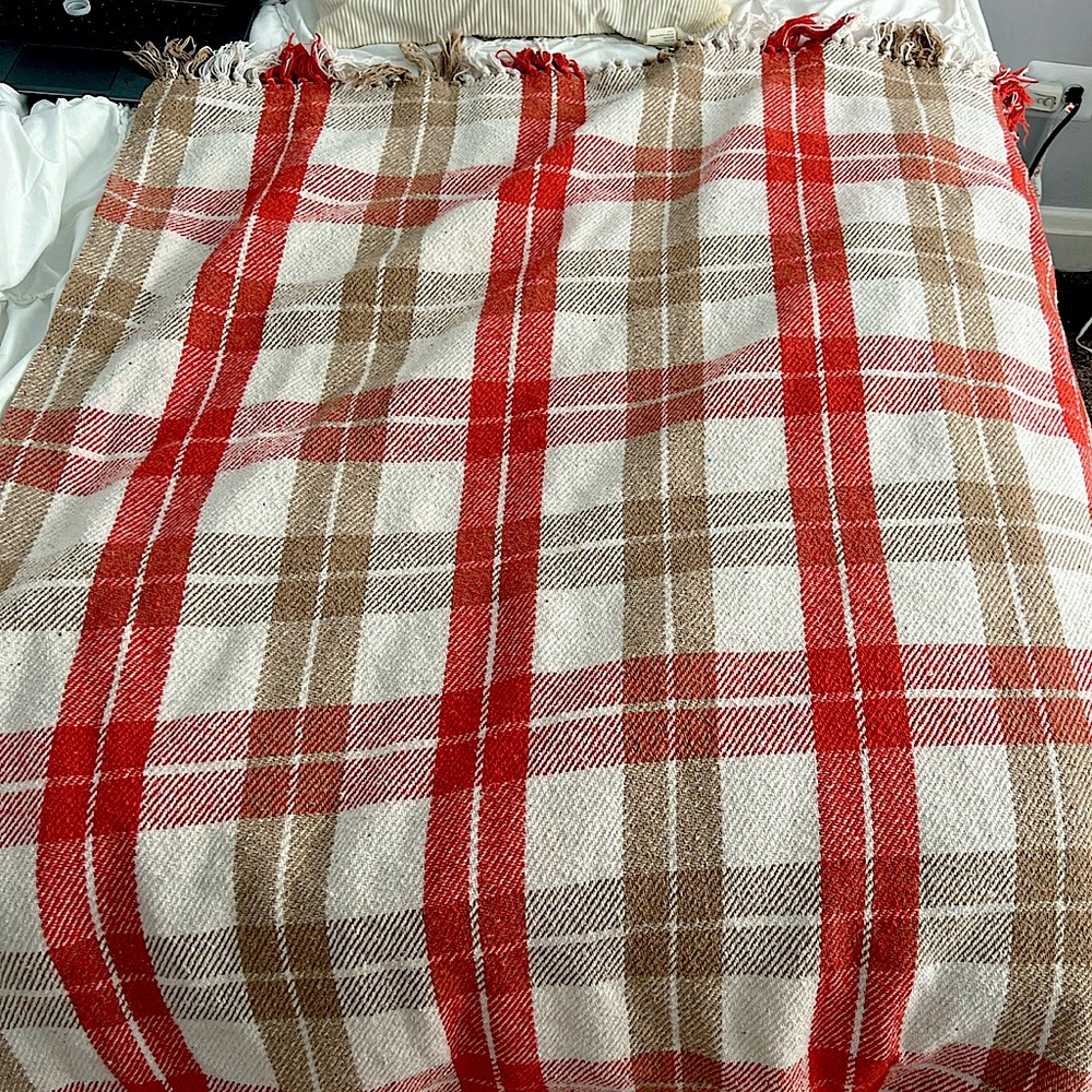 Orange,white and beige throw blanket